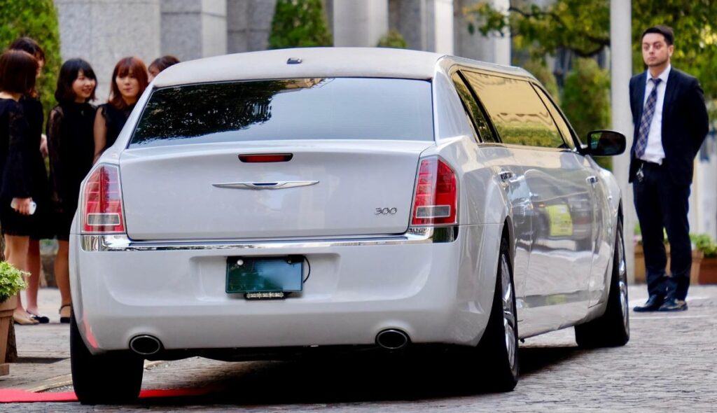 A white Chrysler 300 limo