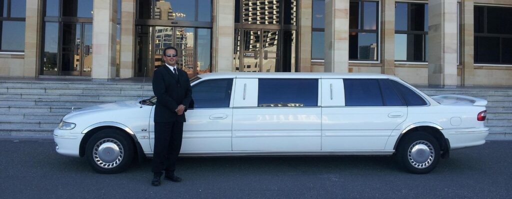 White limousine with chauffeur